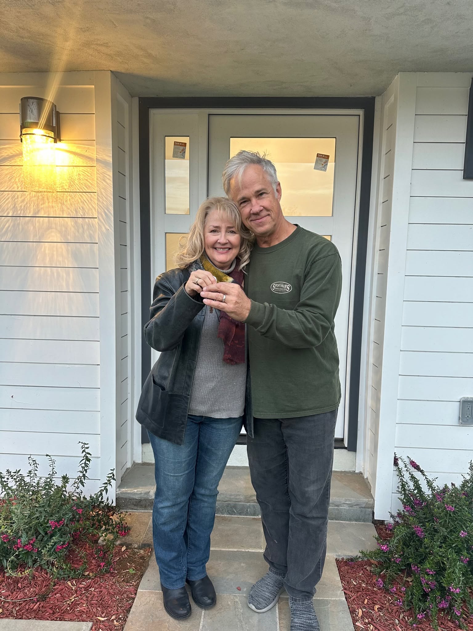 Drew and Nancy with the keys to their Riverside home after coordinating a sale and purchase