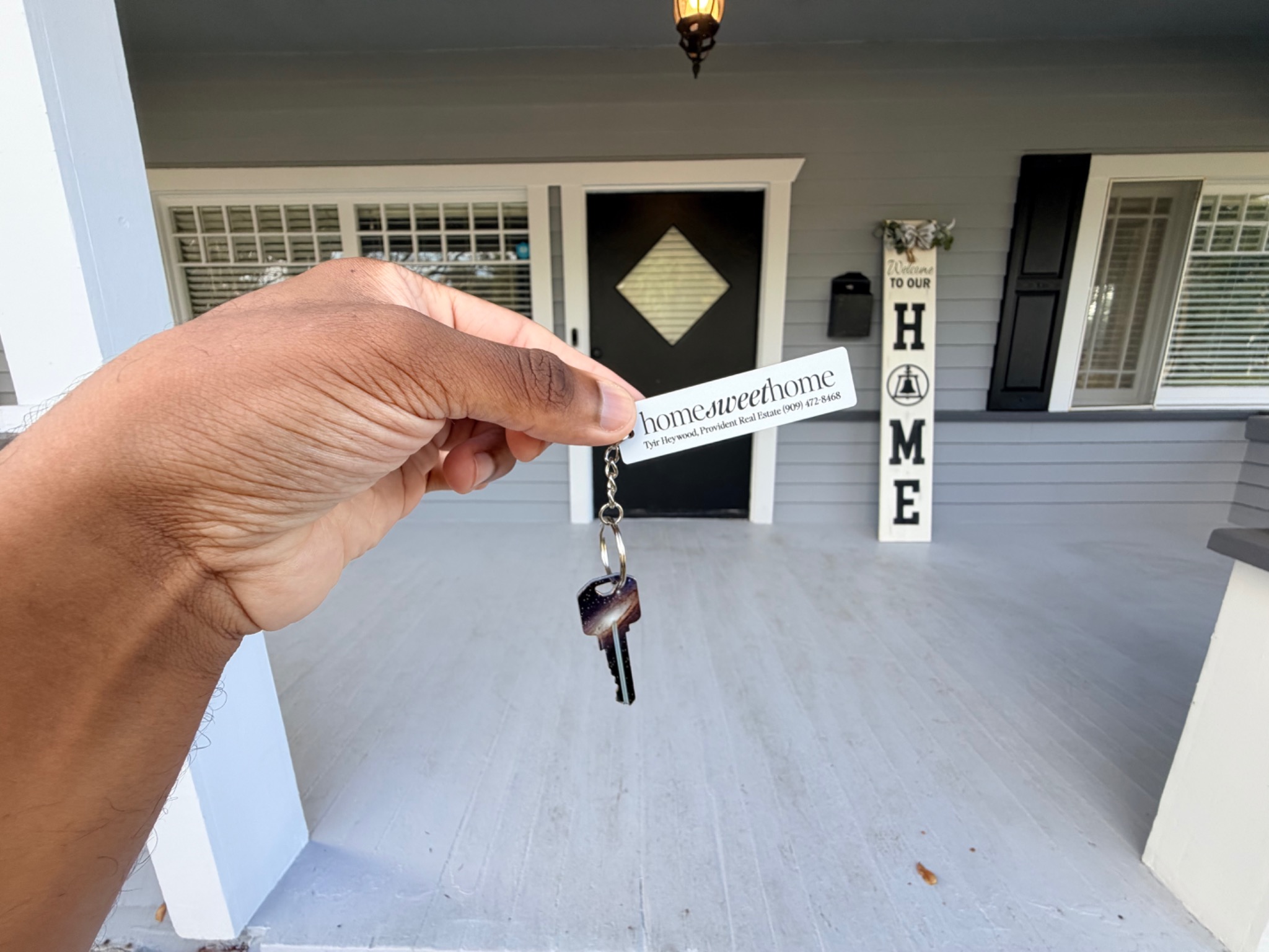 Tyir Heywood handing over the keys to a client's new home